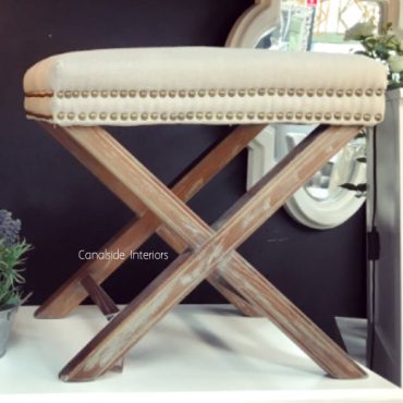 Cream Ottoman with X-Base and Studded Detailing