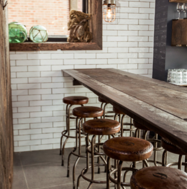 Canalside Interiors' Buck Industrial Stool as featured at Seawall Bar & Restaurant Image C/- seawallrestaurant.com.au